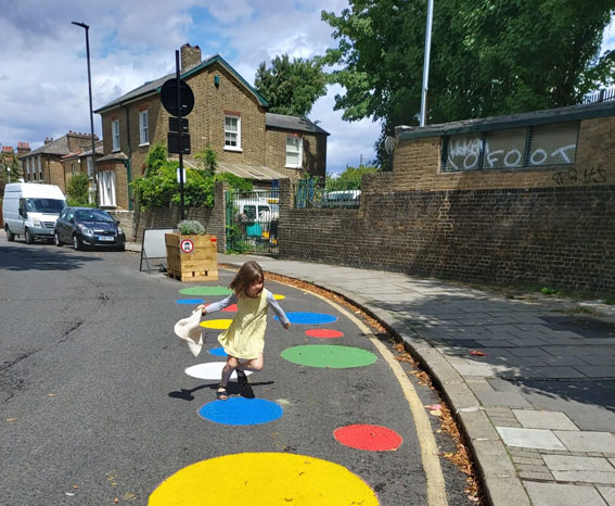 A little girl plays in a Low Traffic Neighbourhood