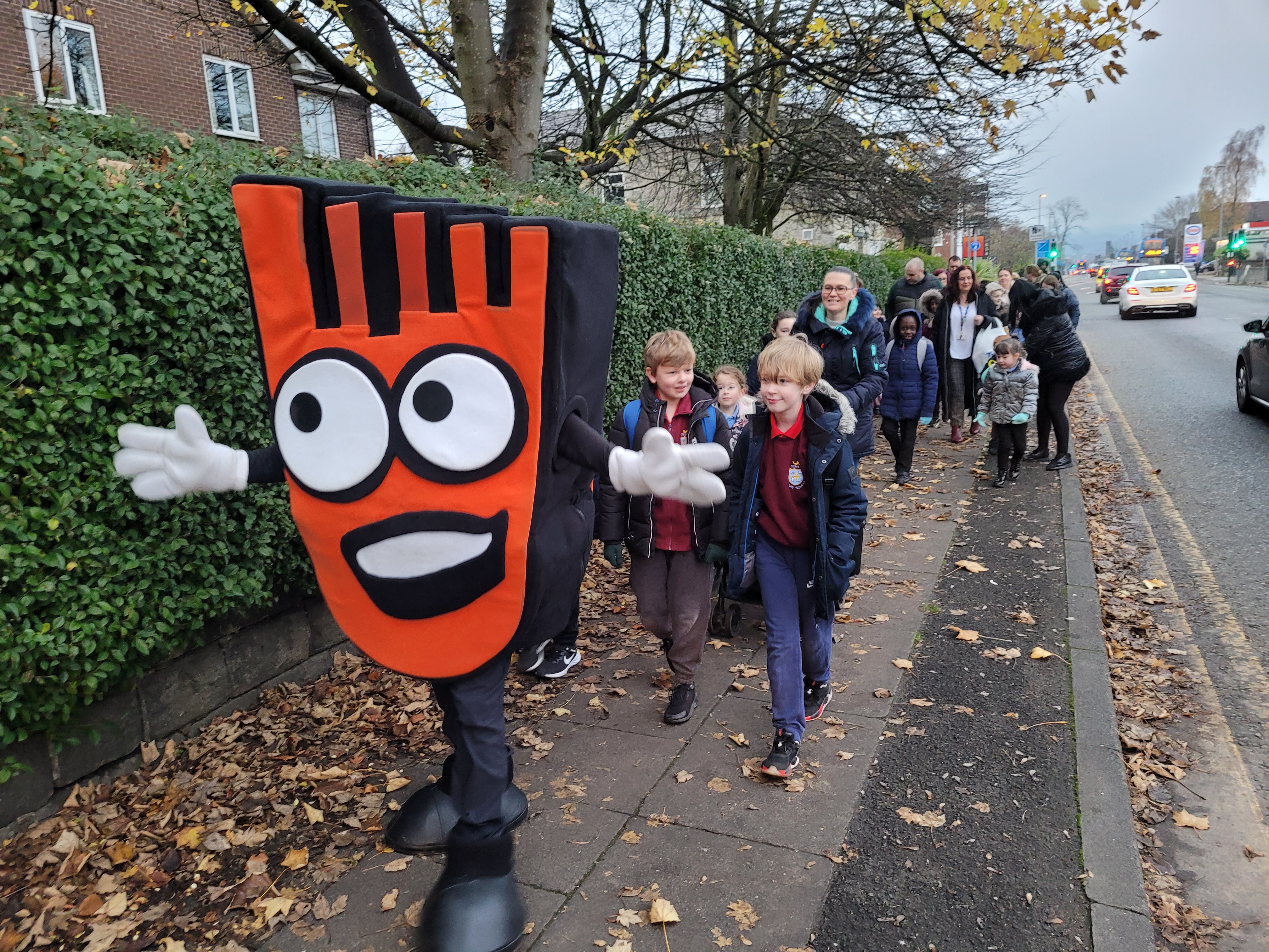 Pupils walking to school with Strider