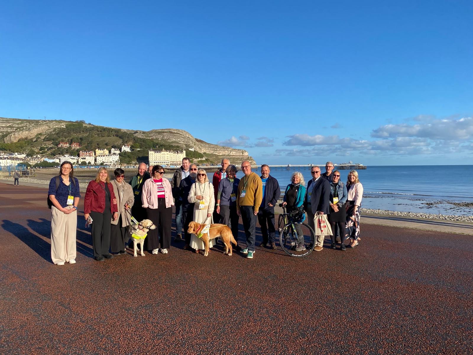 A picture on Llandudno promenade of attendees of this the 2026 "Walk and Talk" event at Plaid Cymru Conference