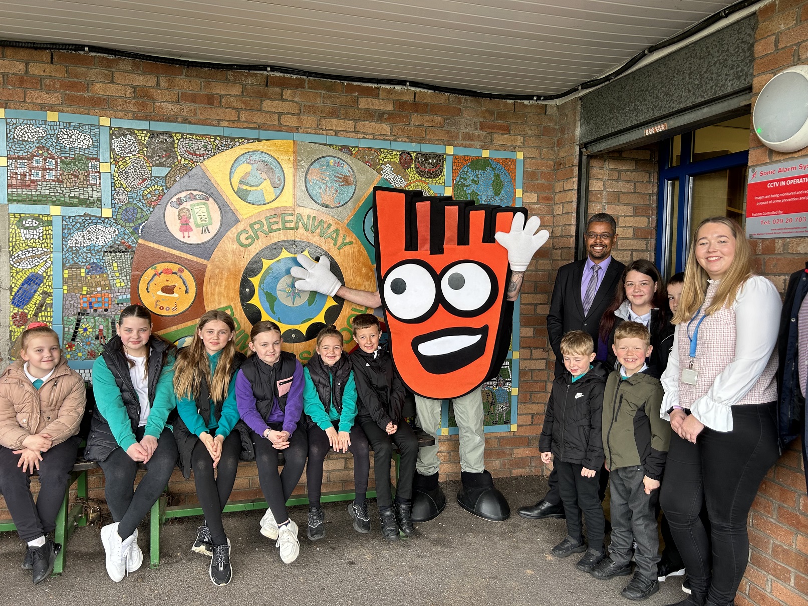 A group of pupils with Strider, Living Streets' mascot