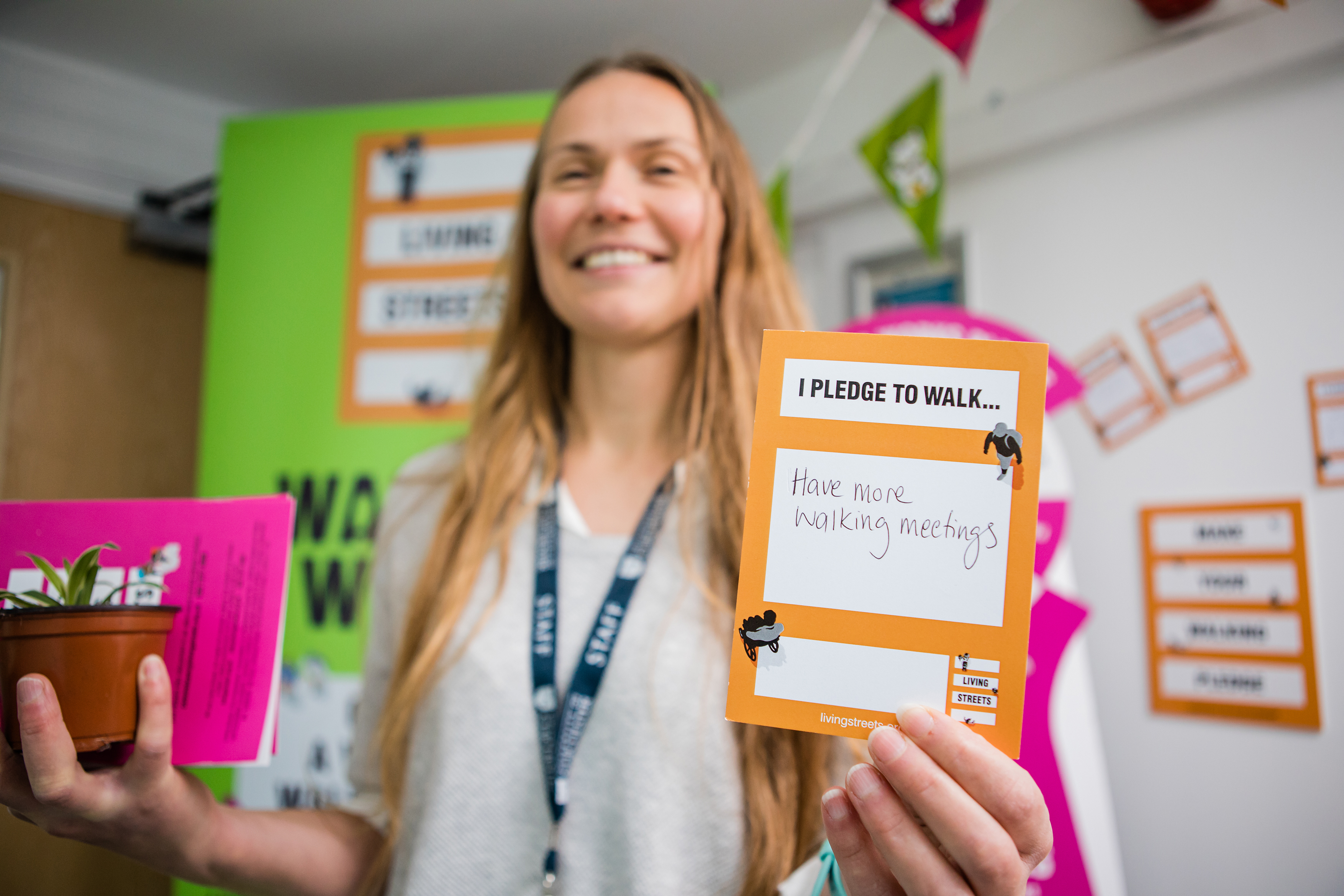 A university student with a pledge card