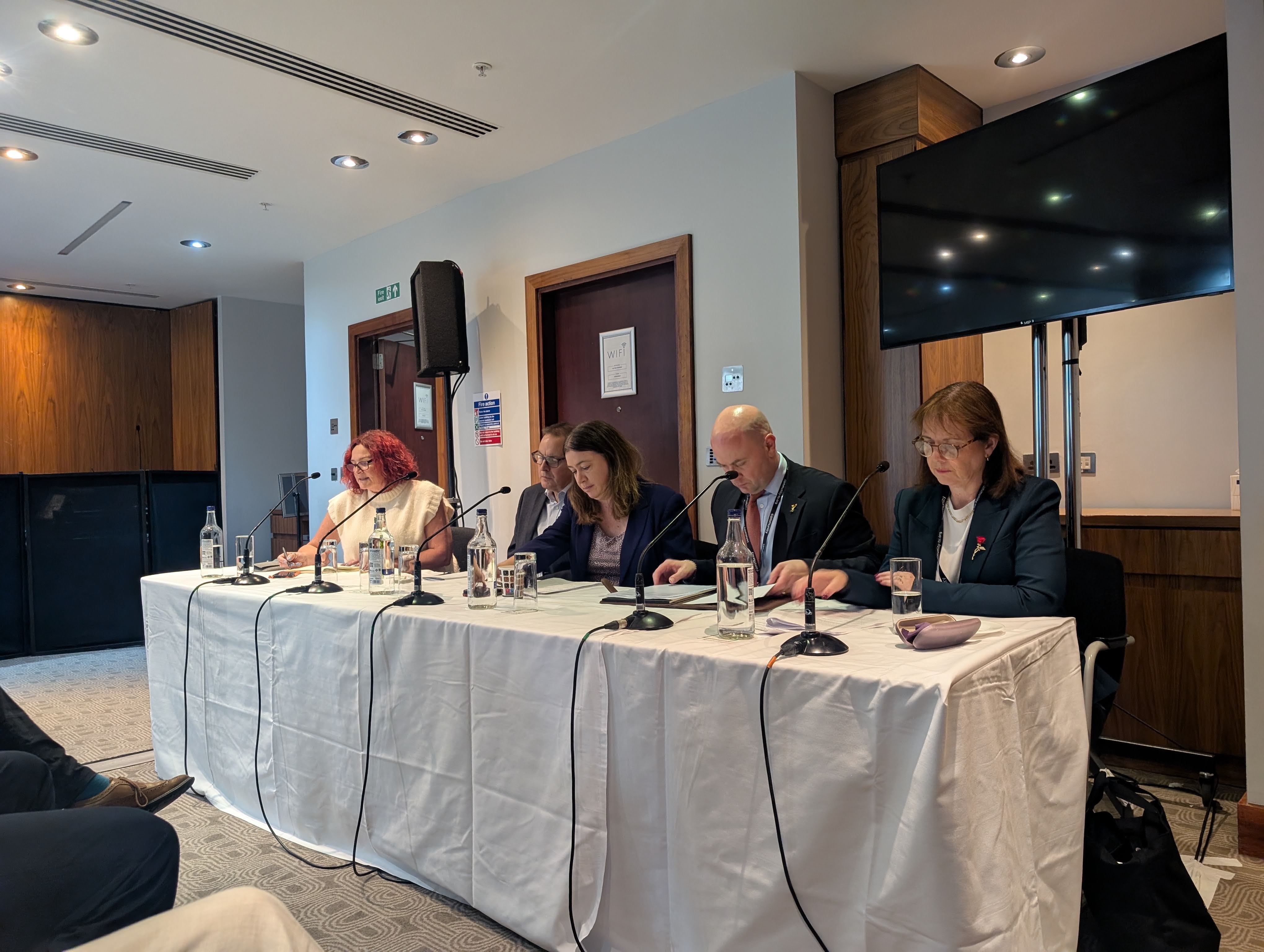 From left: Catherine Woodhead, Dr Scott Arthur MP, Alex Mayer MP, Cllr Liam Robinson and Mayor Claire Ward sit aside each other on a Conference panel