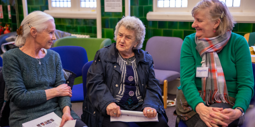 three older women have a discussion