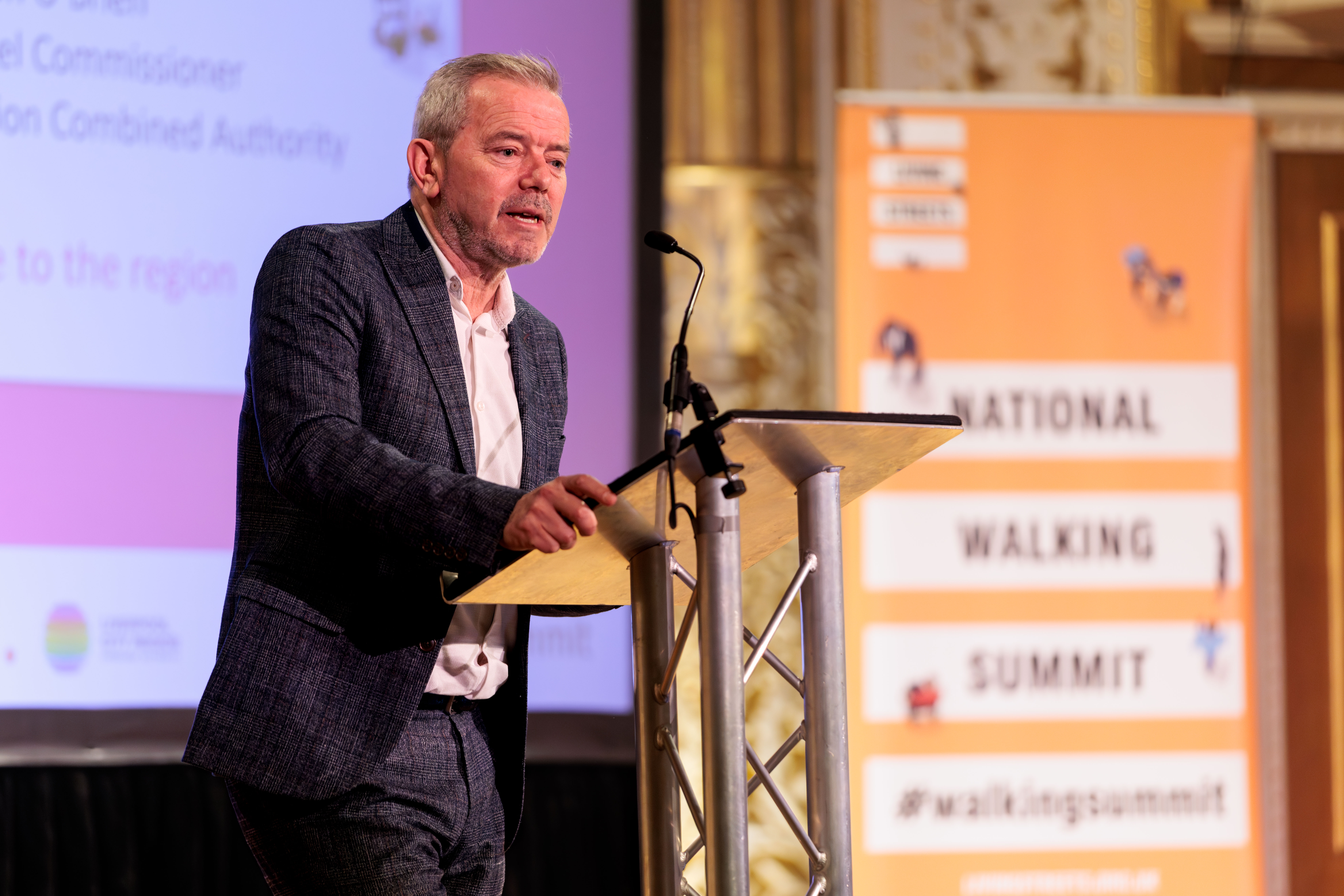 Simon O'Brien on stage at the summit