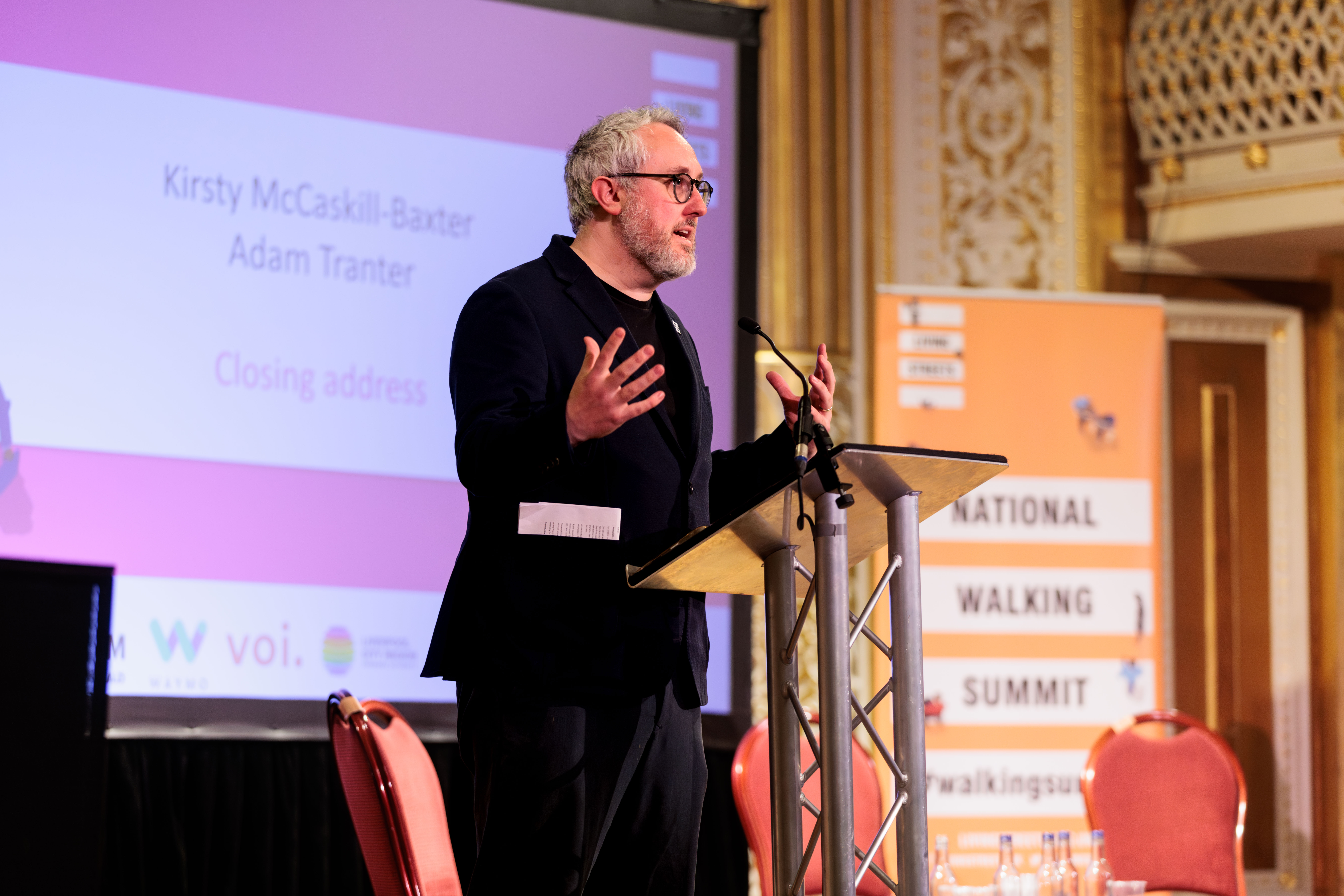 Adam Tranter on stage at the Summit