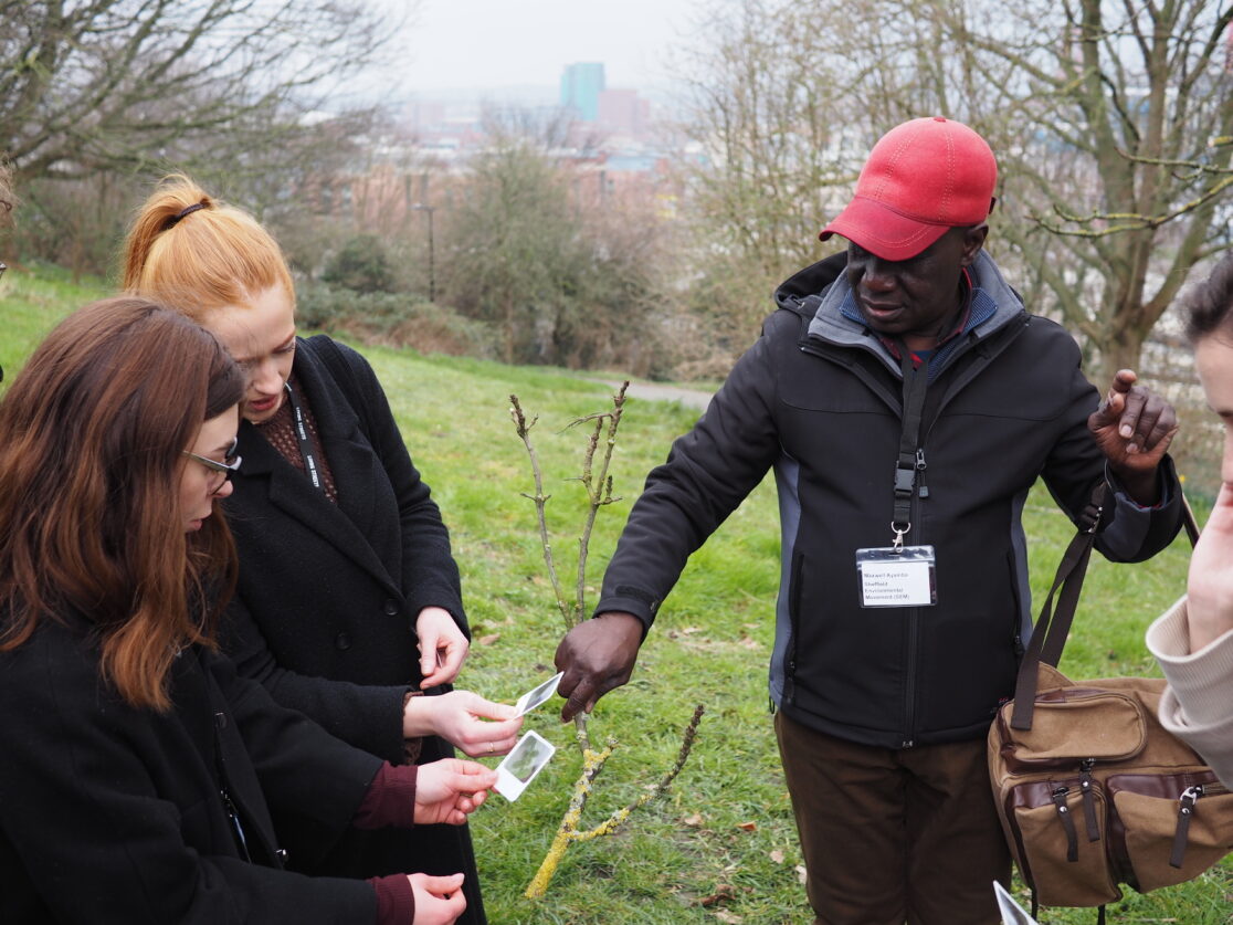 Maxwell from SMW shows two women pictures of air pollution on leaves