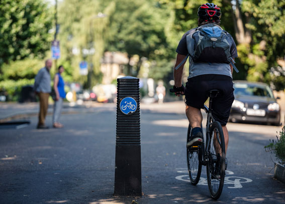 A cyclist and pedestrians at a junction