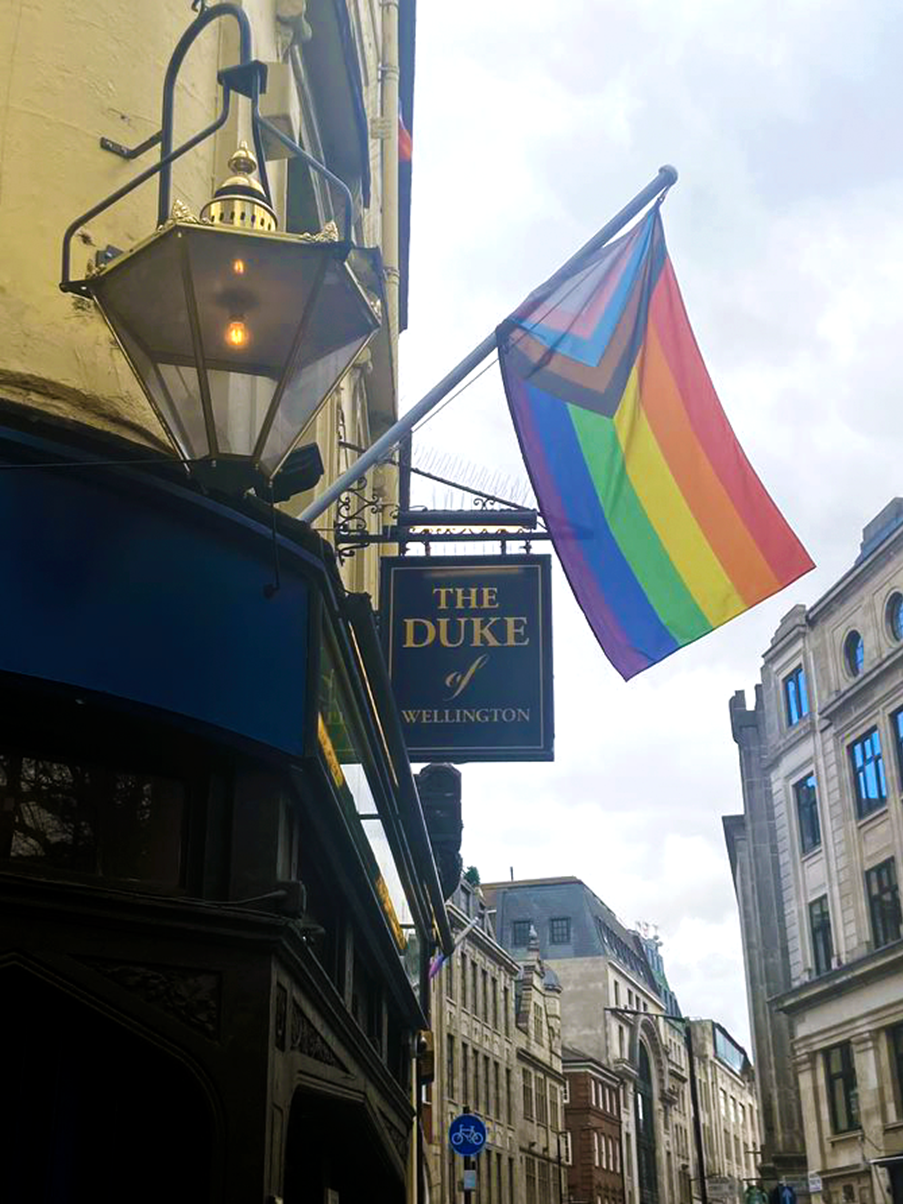 A pride flag flies outside a pub