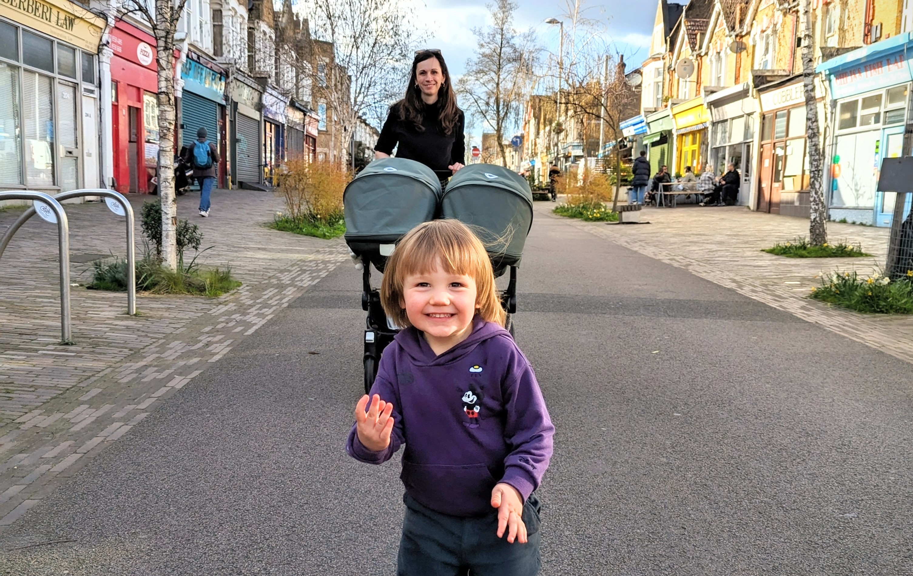 A photo of Tanya walking with her children