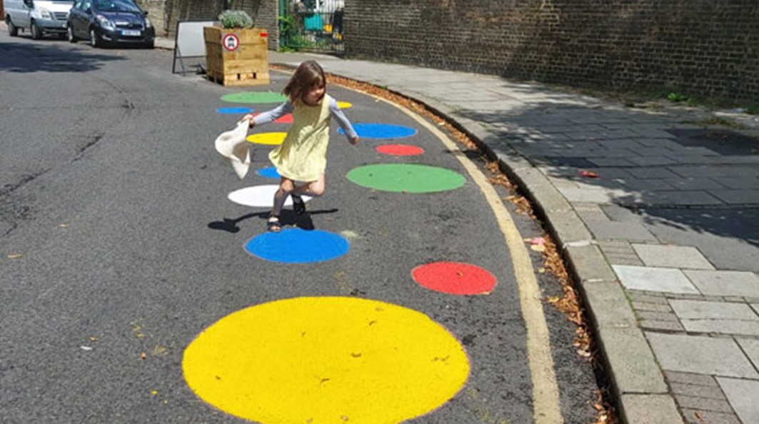 A little girl playing in a Low Traffic Neighbourhood