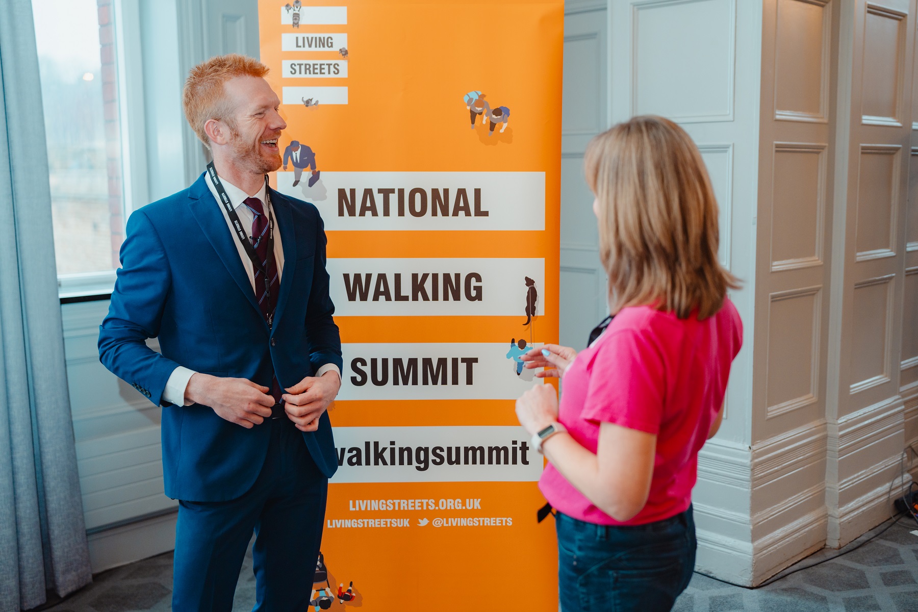 Ed Clancy OBE is laughing with a member of Living Streets' staff