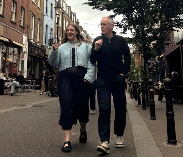 John Dales and Connie Dales walking down a London street