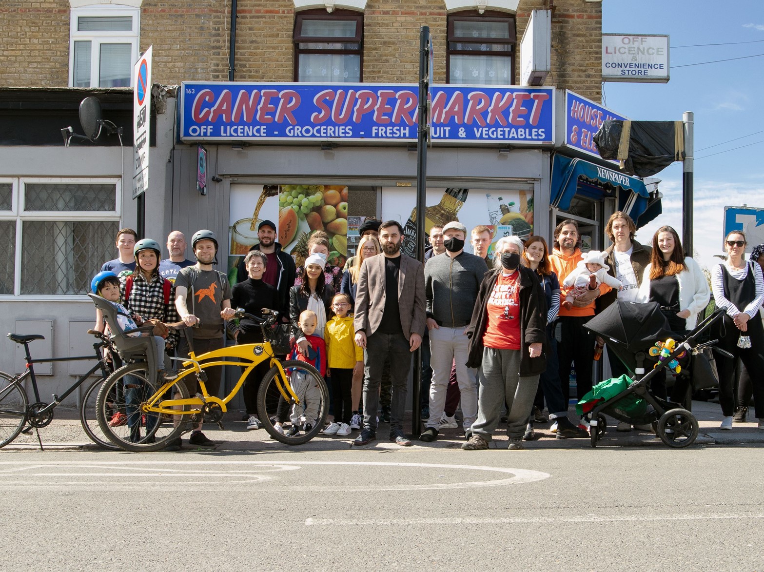 people standing outside a shop