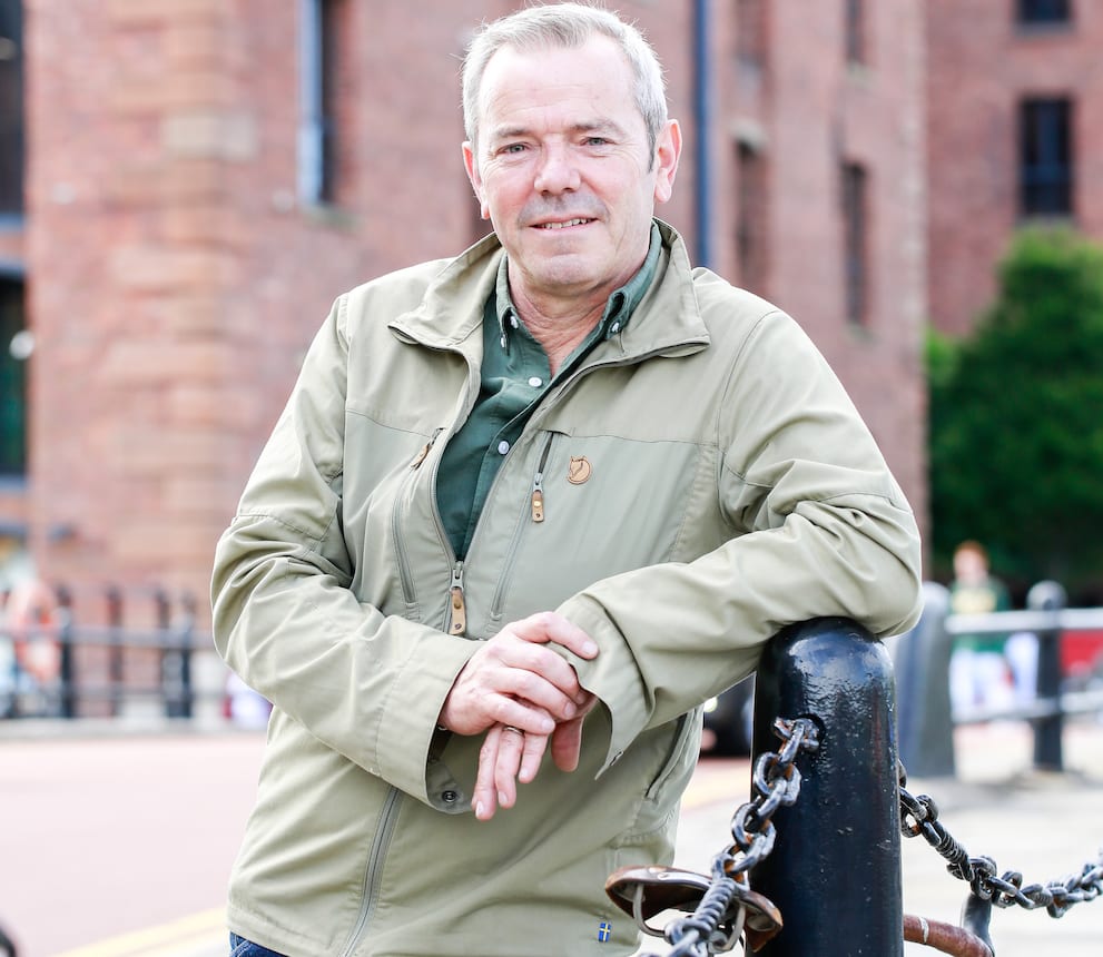 Simon O'Brien poses for a photograph in Albert Dock, Liverpool