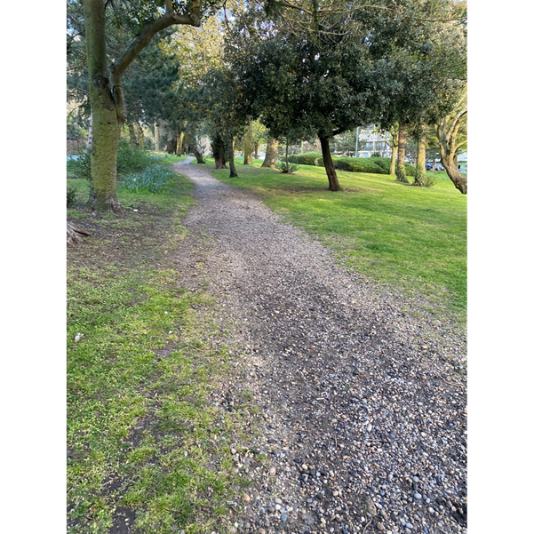 a gravel path in a park