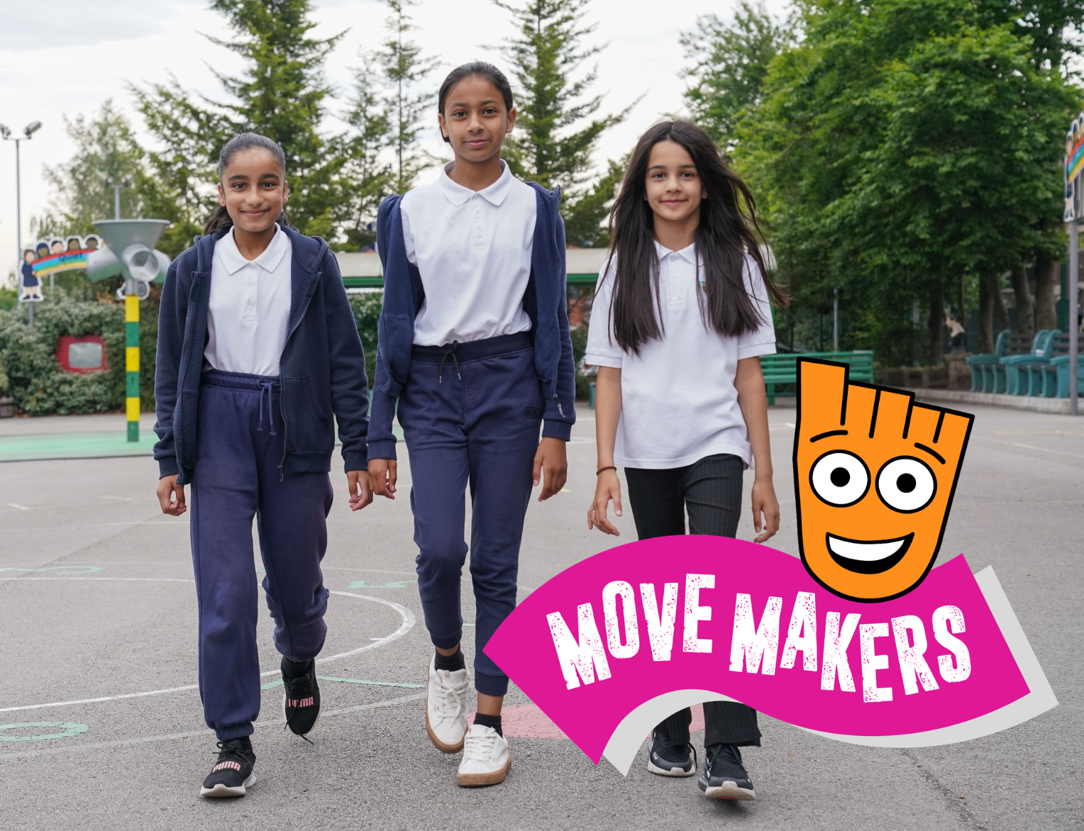 Three girls walking in a school yard with the Living Streets Move Makers logo in the corner.